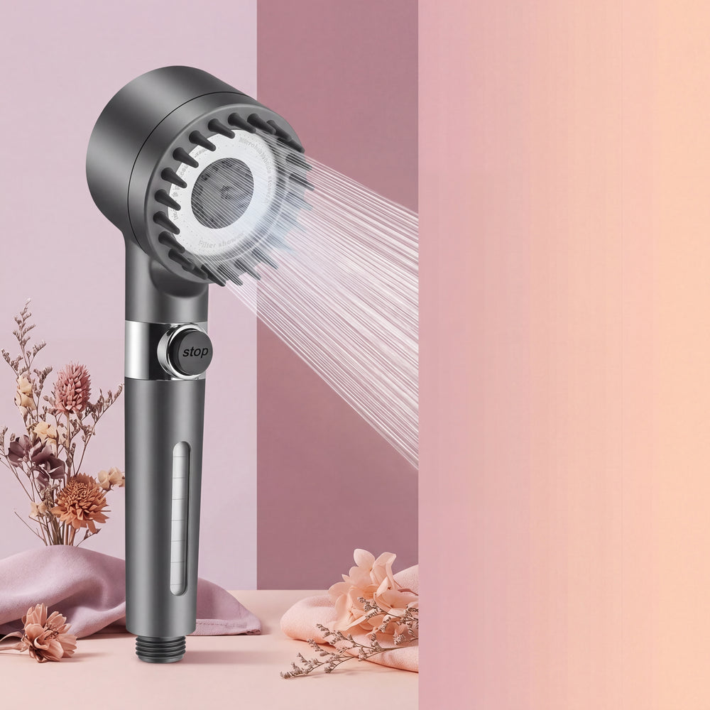 Filtered Shower Head Scalp Massager with visible micro nozzles, showing a powerful water stream, against a pale mauve to dust